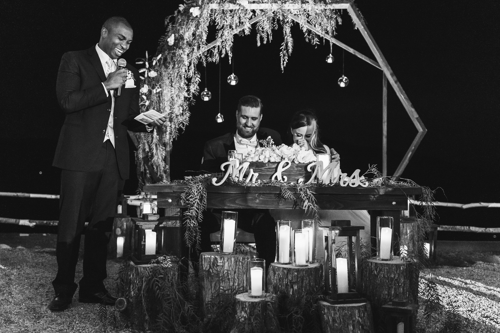 best man giving speech next to bride and groom